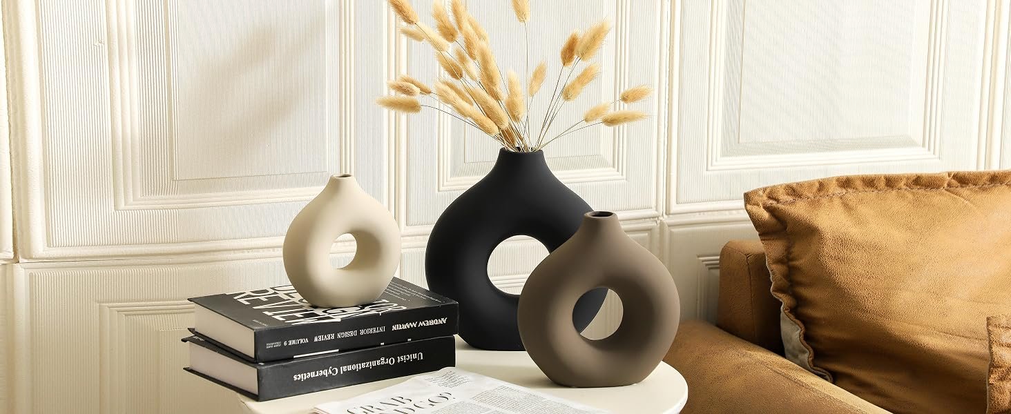 Handcrafted modern ceramic vase set with dried pampas grass in living room deco